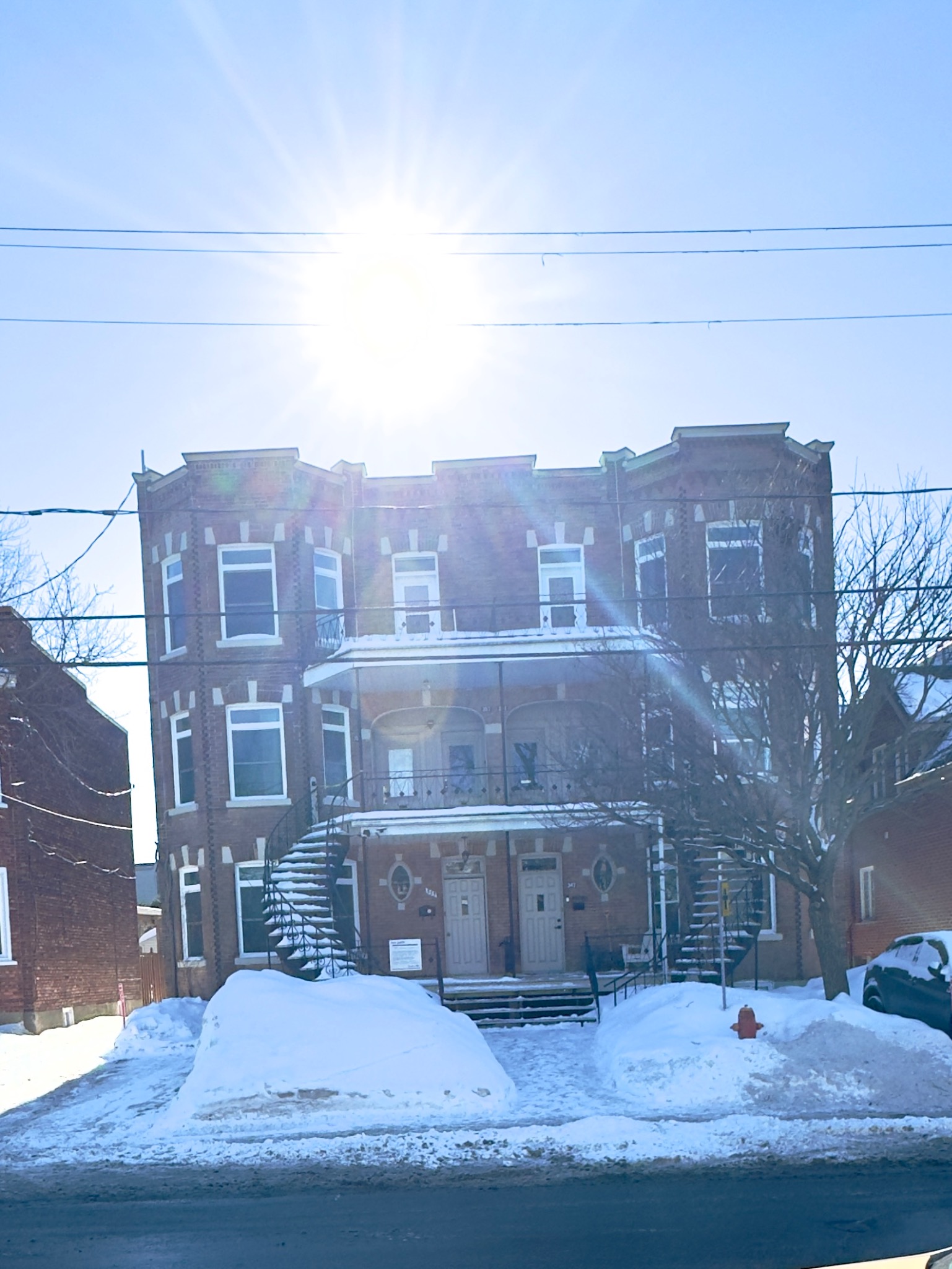 Public notice on the St-Lambert sixplex, Quebec. Photograph by Richard Wainwright.